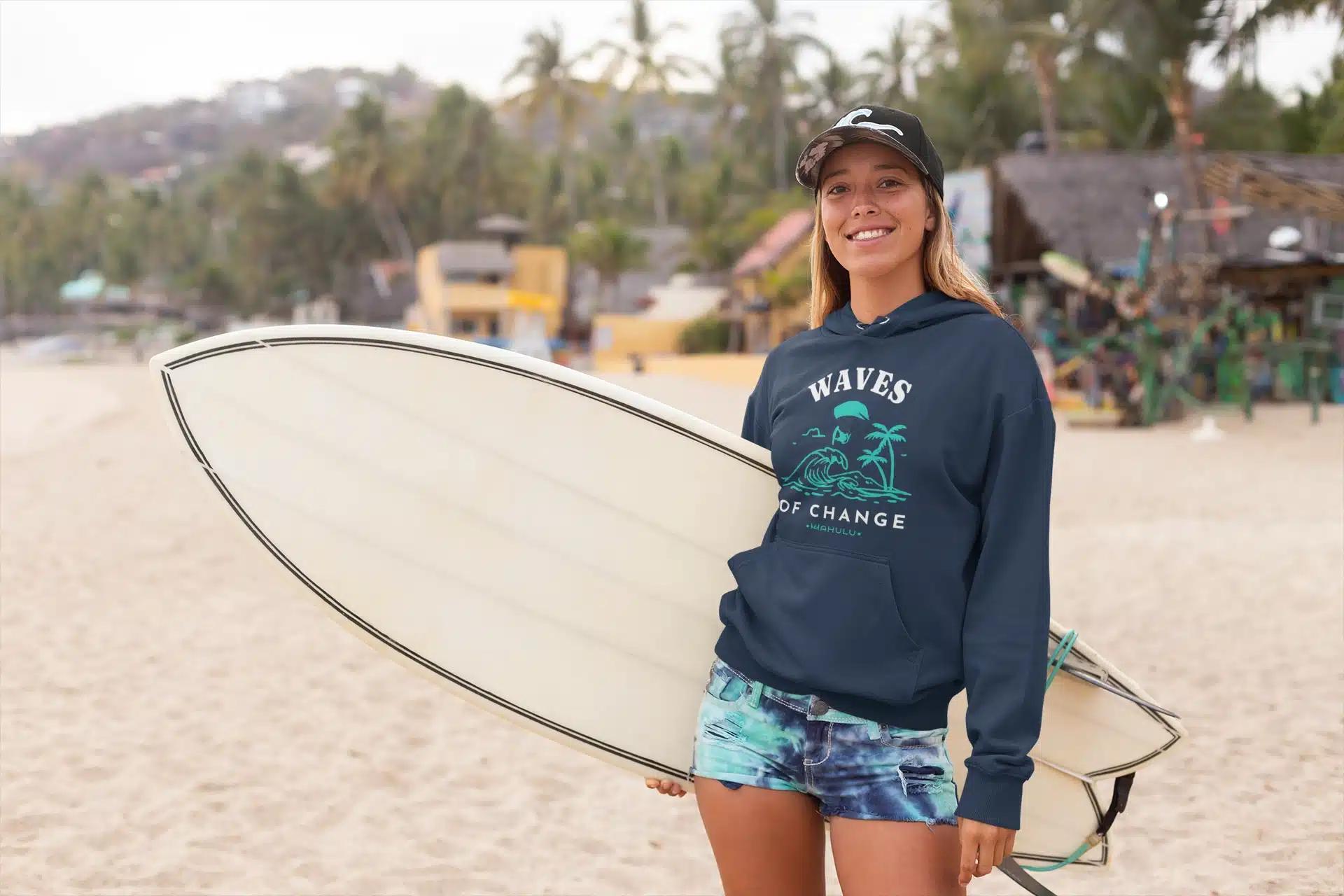 mockup of a cool surfer woman standing on a beach wearing a hoodie 26814 (3)